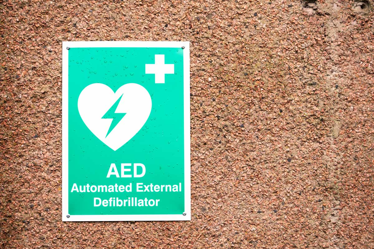 Green AED automated external defibrillator wall sign