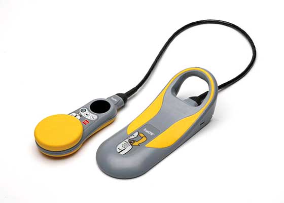 Yellow and gray handheld electronic control device with cable